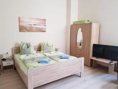 Ein Bett oder Betten in einem Zimmer der Unterkunft Villa Brockenstürmer