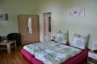 Ein Bett oder Betten in einem Zimmer der Unterkunft Villa Brockenstürmer