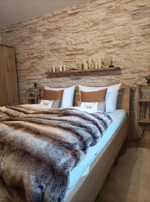 Ein Bett oder Betten in einem Zimmer der Unterkunft Harzglanz FeWo's KuschelBude