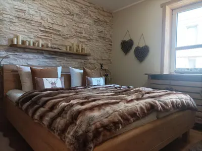Ein Bett oder Betten in einem Zimmer der Unterkunft Harzglanz FeWo's KuschelBude