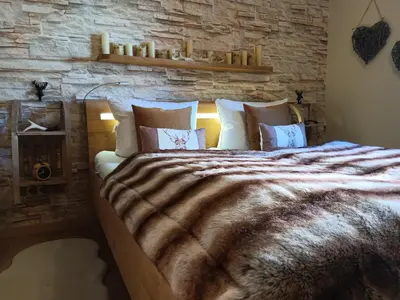 Ein Bett oder Betten in einem Zimmer der Unterkunft Harzglanz FeWo's KuschelBude