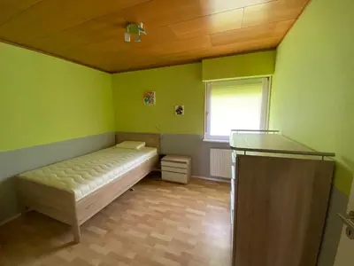 Ein Bett oder Betten in einem Zimmer der Unterkunft Brockenblick