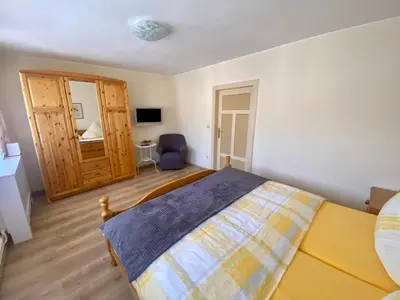 Ein Bett oder Betten in einem Zimmer der Unterkunft Ferienwohnung SILBERBACH im HAUS Gerlach