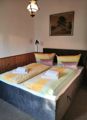 Ein Bett oder Betten in einem Zimmer der Unterkunft Haus Fessel - Helenenruh