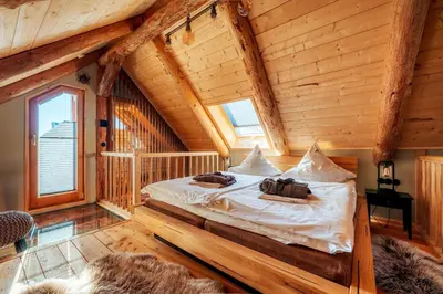 Ein Bett oder Betten in einem Zimmer der Unterkunft Blockhaus PanHütte