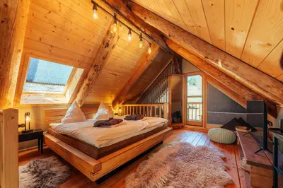 Ein Bett oder Betten in einem Zimmer der Unterkunft Blockhaus PanHütte
