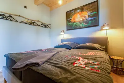 Ein Bett oder Betten in einem Zimmer der Unterkunft Panorama-Chalet im Harz
