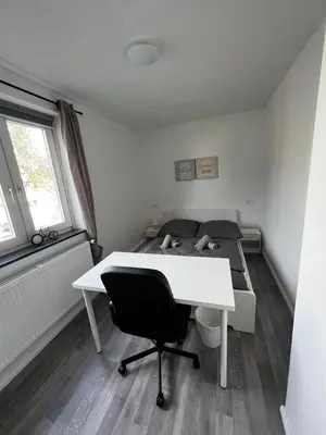 Ein Bett oder Betten in einem Zimmer der Unterkunft Ferienwohnung Carlos 1 und 2