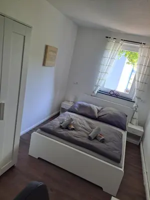 Ein Bett oder Betten in einem Zimmer der Unterkunft Ferienwohnung Carlos 1 und 2