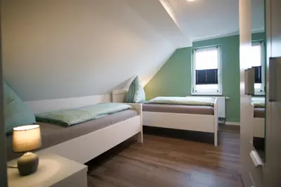 Ein Bett oder Betten in einem Zimmer der Unterkunft Ferienwohnung Busch 3