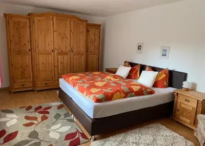 Ein Bett oder Betten in einem Zimmer der Unterkunft Ferienwohnung Tannhäuser