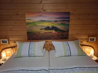 Ein Bett oder Betten in einem Zimmer der Unterkunft Blockhaus 