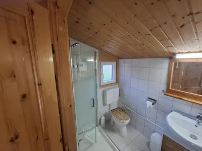 Ein Badezimmer in der Unterkunft Blockhaus 