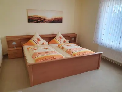 Ein Bett oder Betten in einem Zimmer der Unterkunft Ferienhaus Müller