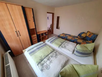 Ein Bett oder Betten in einem Zimmer der Unterkunft Ferienhaus Riemenschneider