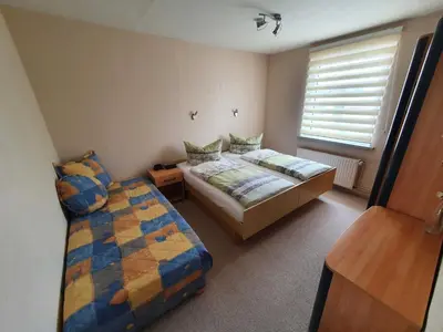Ein Bett oder Betten in einem Zimmer der Unterkunft Ferienhaus Riemenschneider