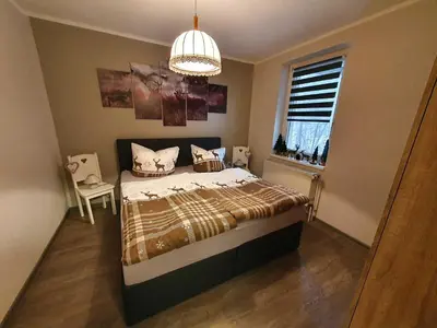 Ein Bett oder Betten in einem Zimmer der Unterkunft Ferienwohnung 