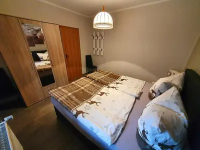 Ein Bett oder Betten in einem Zimmer der Unterkunft Ferienwohnung 