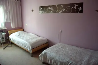 Ein Bett oder Betten in einem Zimmer der Unterkunft Ferienwohnung 