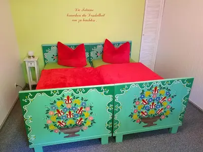 Ein Bett oder Betten in einem Zimmer der Unterkunft Ferienwohnung Monique am Stieger See