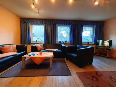 Ein Sitzbereich in der Unterkunft Ferienwohnungen Königshof