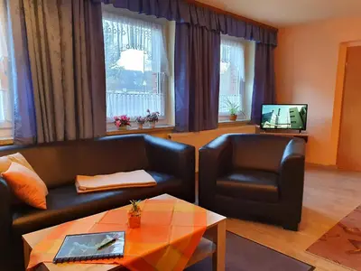 Ein Sitzbereich in der Unterkunft Ferienwohnungen Königshof