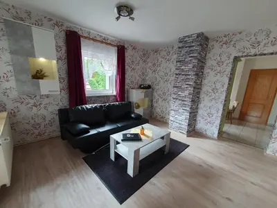 Ein Sitzbereich in der Unterkunft Ferienwohnungen Königshof
