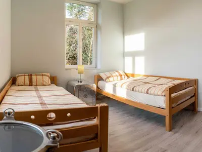 Ein Bett oder Betten in einem Zimmer der Unterkunft Ferienwohnungen Tanner Hütte