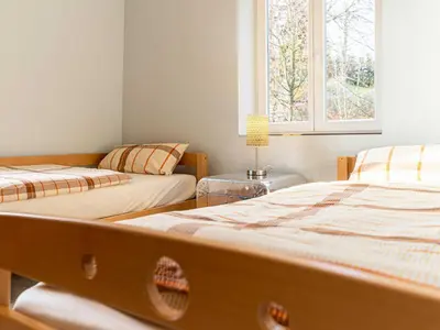 Ein Bett oder Betten in einem Zimmer der Unterkunft Ferienwohnungen Tanner Hütte