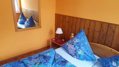 Ein Bett oder Betten in einem Zimmer der Unterkunft Ferienwohnung Schulze-Falck