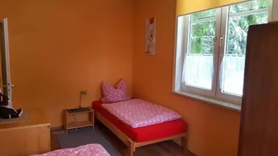 Ein Bett oder Betten in einem Zimmer der Unterkunft Ferienwohnung Schulze-Falck