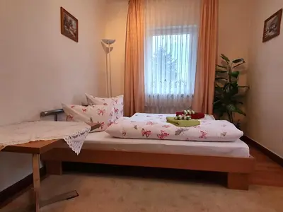 Ein Bett oder Betten in einem Zimmer der Unterkunft Ferienwohnung Walpurga