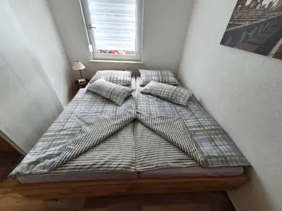 Ein Bett oder Betten in einem Zimmer der Unterkunft Ferienwohnung Schenk