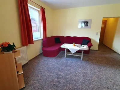 Ein Sitzbereich in der Unterkunft Pension Königshof