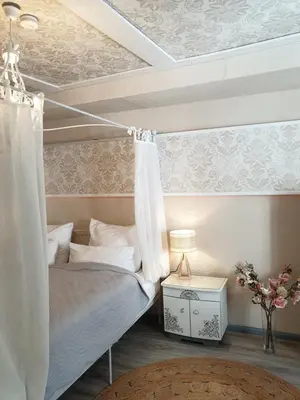 Ein Bett oder Betten in einem Zimmer der Unterkunft Stillvolle Designwohnung im historischen Zentrum