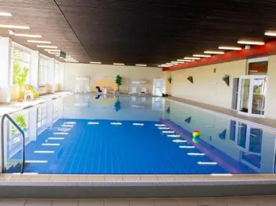 Der Swimmingpool an oder in der Nähe von Apartment Harzfeuer mit wunderbarem Ausblick und Schwimmbad