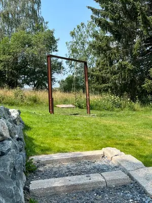 Ein Garten an der Unterkunft BERGLAGE - Das UrlaubZuhause - Ferienhäuser