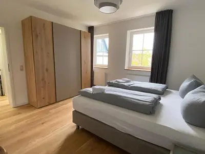 Ein Bett oder Betten in einem Zimmer der Unterkunft BERGLAGE - Das UrlaubZuhause - Ferienhäuser