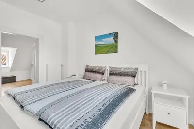Ein Bett oder Betten in einem Zimmer der Unterkunft Altstadt-Refugium unterm Dach Goslar
