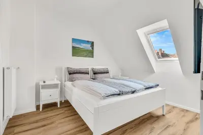 Ein Bett oder Betten in einem Zimmer der Unterkunft Altstadt-Refugium unterm Dach Goslar