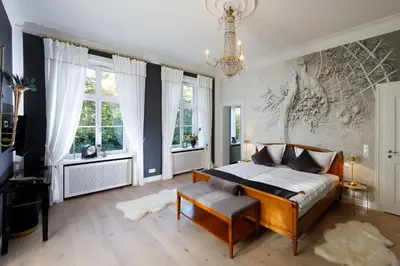 Ein Bett oder Betten in einem Zimmer der Unterkunft Luxus Hotel Design Villa Ottilienruh Ilsenburg im Harz