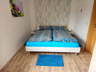 Ein Bett oder Betten in einem Zimmer der Unterkunft Ferienwohnung Martina