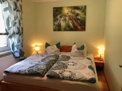 Ein Bett oder Betten in einem Zimmer der Unterkunft Ferienhaus 1 - a72651