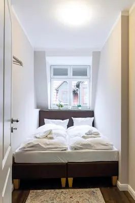 Ein Bett oder Betten in einem Zimmer der Unterkunft Domizile am Markt