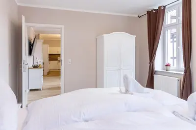 Ein Bett oder Betten in einem Zimmer der Unterkunft Domizile am Markt