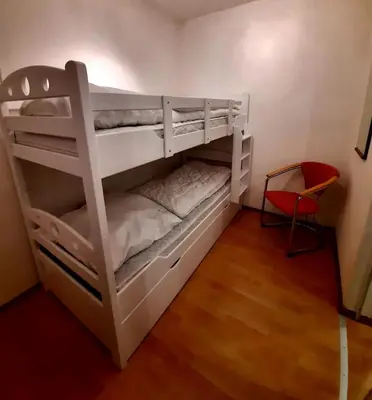Ein Bett oder Betten in einem Zimmer der Unterkunft Gipfelstürmer