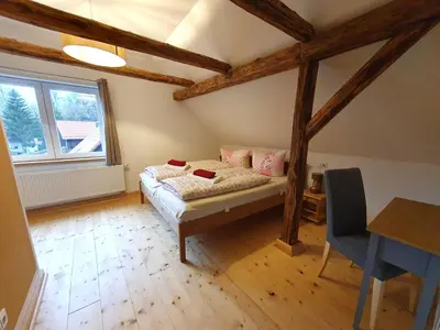 Ein Bett oder Betten in einem Zimmer der Unterkunft Kleine Bergstraße 2 - Haus 1