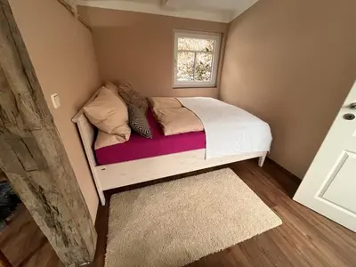 Ein Bett oder Betten in einem Zimmer der Unterkunft kleines Harz-Chalet