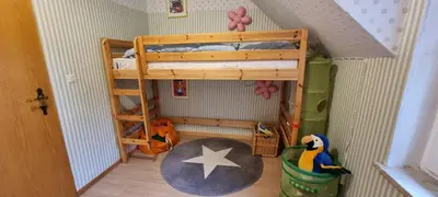 Ein Etagenbett oder Etagenbetten in einem Zimmer der Unterkunft Braunlage Vintage Quartier - Haus bis 16 Personen - 8 Zimmer WG