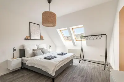 Ein Bett oder Betten in einem Zimmer der Unterkunft Modernes Apartment am Campus - Parken - Smart-TV - Kaffeevollautomat